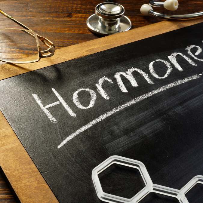 a chalk board displaying the word, hormone as it relates to hidden reasons for weight loss struggles